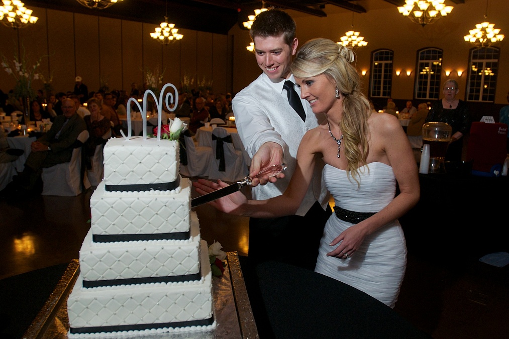 Cutting the wedding cake at Bella Sala in Tiffin, Iowa.