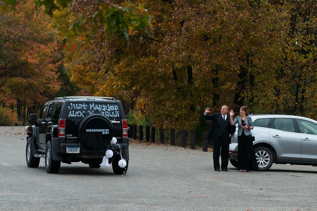 The couple departs after their wedding ceremony at F.W. Kent Park in Johnson County, Iowa.