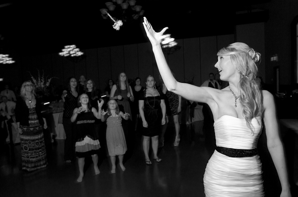 Bouquet toss during the wedding reception.