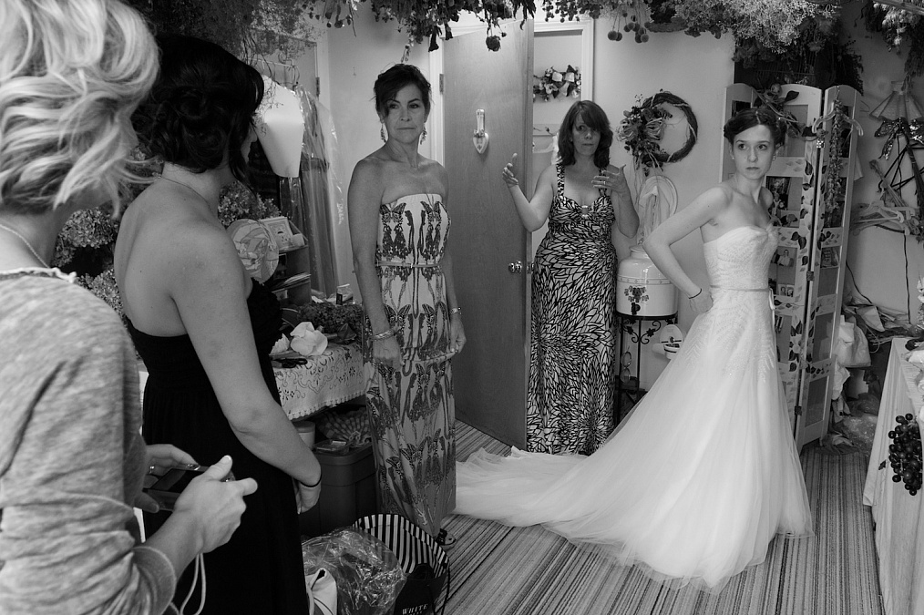 The bridal party prepares for Meagan's wedding at the Gardens at Gazebo on the Green in Iowa City, Iowa.