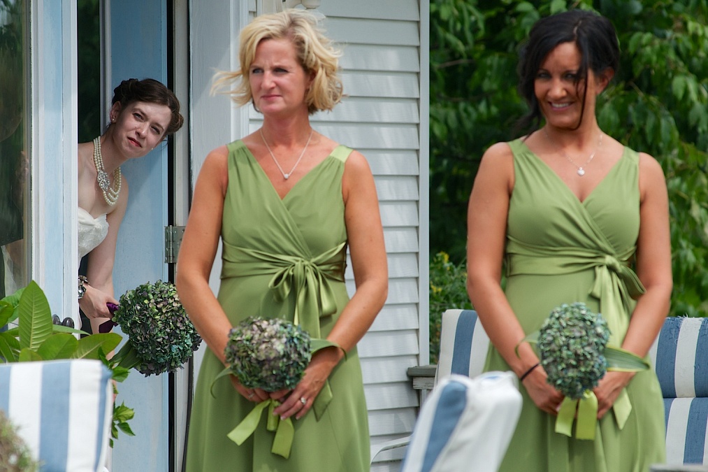 The bridal party awaits the start of Meagan's wedding at the Gardens at Gazebo on the Green in Iowa City, Iowa.